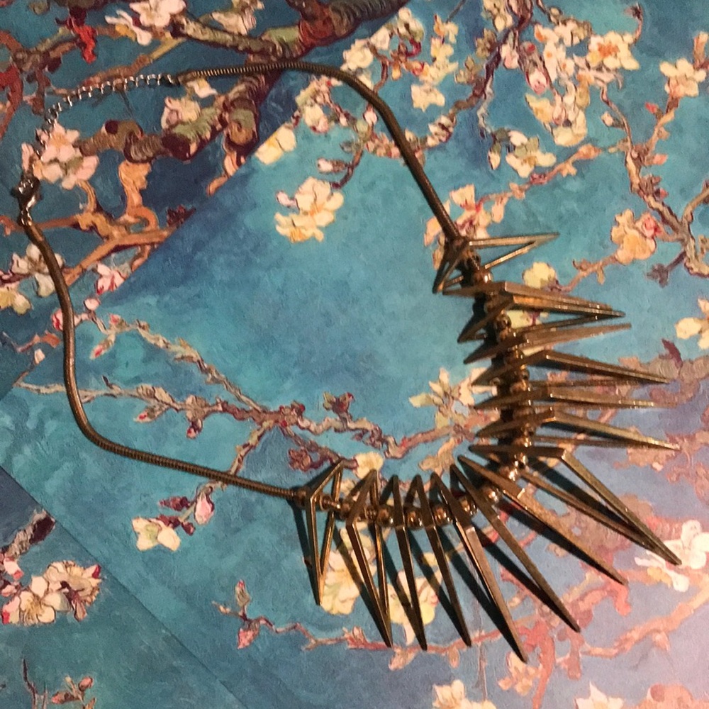 2/14$! Unique 3-D gold statement necklace. Triangular pendants on gold cord.